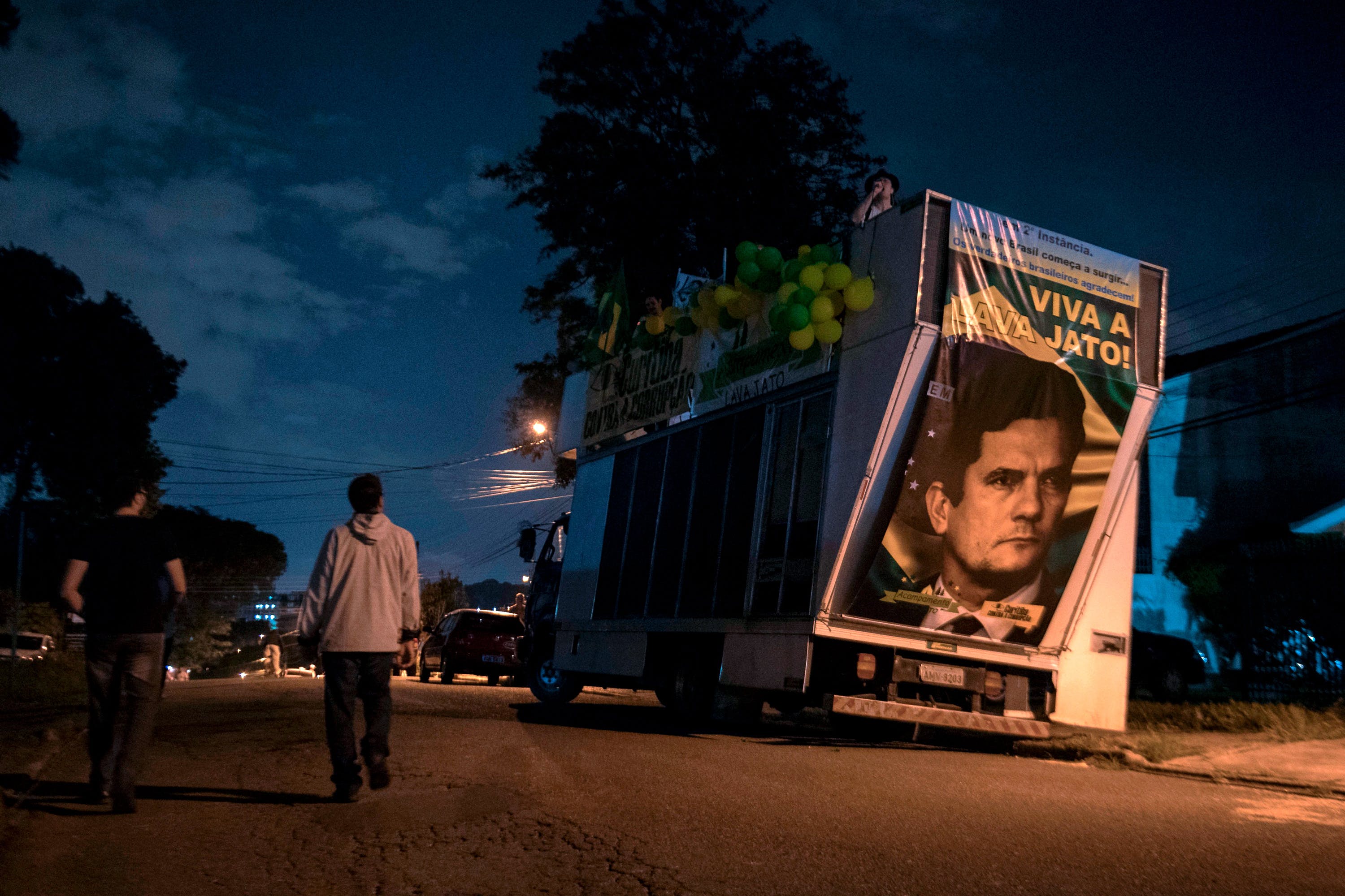 View of a truck with a portrait of Brazilian judge Sergio Moro reading "Long live Lava Jato", referring to an anti-corrption operation, during a protest against Brazilian former president (2003-2011) Luiz Inacio Lula Da Silva outside the Federal Police headquarters, where he is awaited to start his 12-year prison sentence in Curitiba, Parana, Brazil. Lula da Silva, the controversial frontrunner in Brazil's October presidential election, remained defiantly holed up Friday as a deadline for him to surrender and start a 12-year prison sentence for corruption loomed. 
