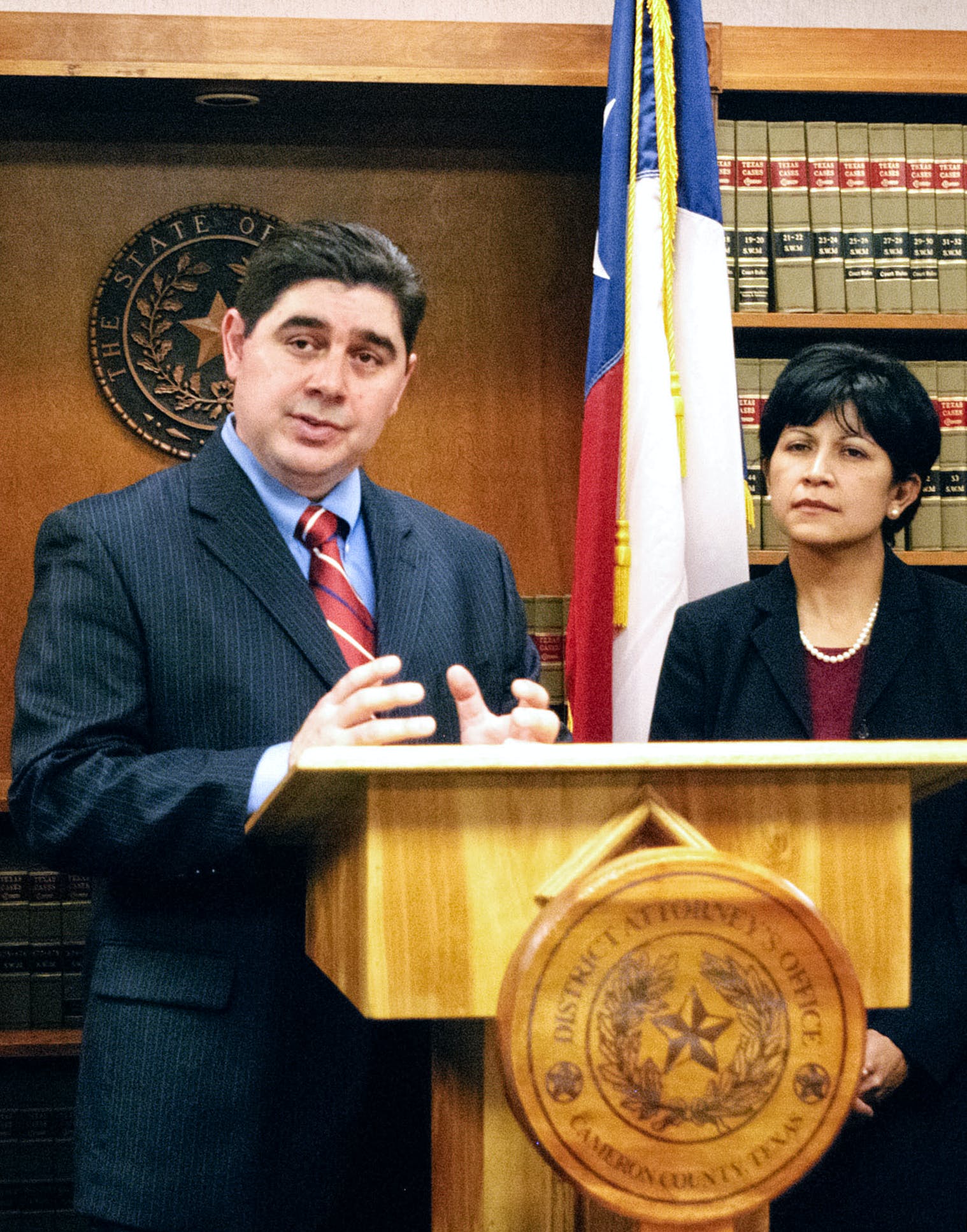 District Attorney Armando Villalobos, left, speaks at a press conference Thursday July 10, 2008 after Melissa Elizabeth Lucio was sentenced to death at the 138th state District Court in Brownsville, Texas. Lucio was found guilty of beating to death her 2-½ year old daughter on Feb. 17, 2007. (AP Photo/Valley Morning Star, Theresa Najera)